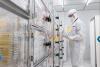 Microfluidic molecular exchanger helps control therapeutic cell manufacturing